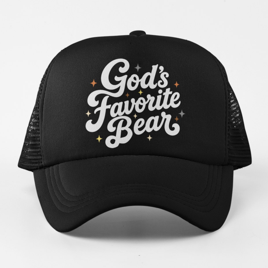 A black trucker-style baseball cap with white embroidered text reading 'God's Favorite Bear' and small orange star accents, shown against a plain light gray background.